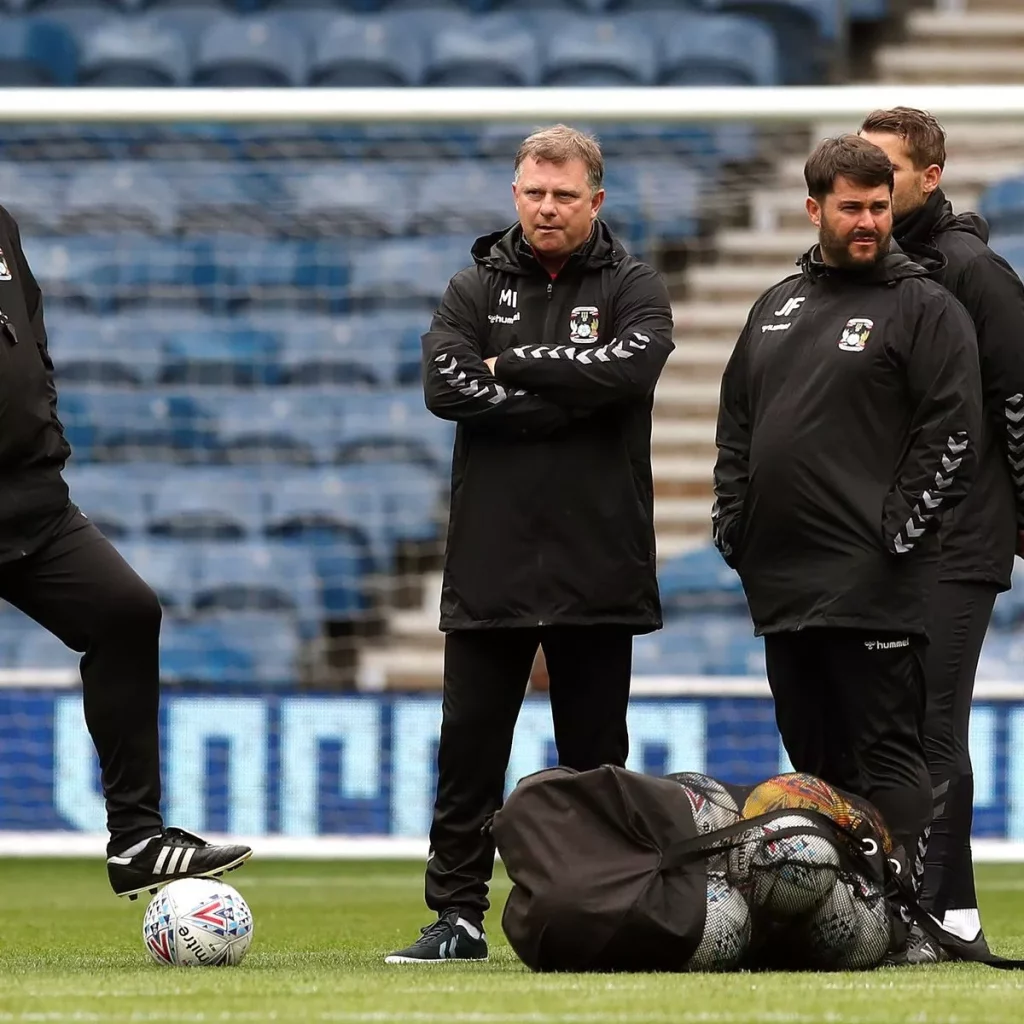 0_Coventry-City-manager-Mark-Robins-centre-watches-his-team-warm-up-ahead-of-the-pre-season-friendly-match-against